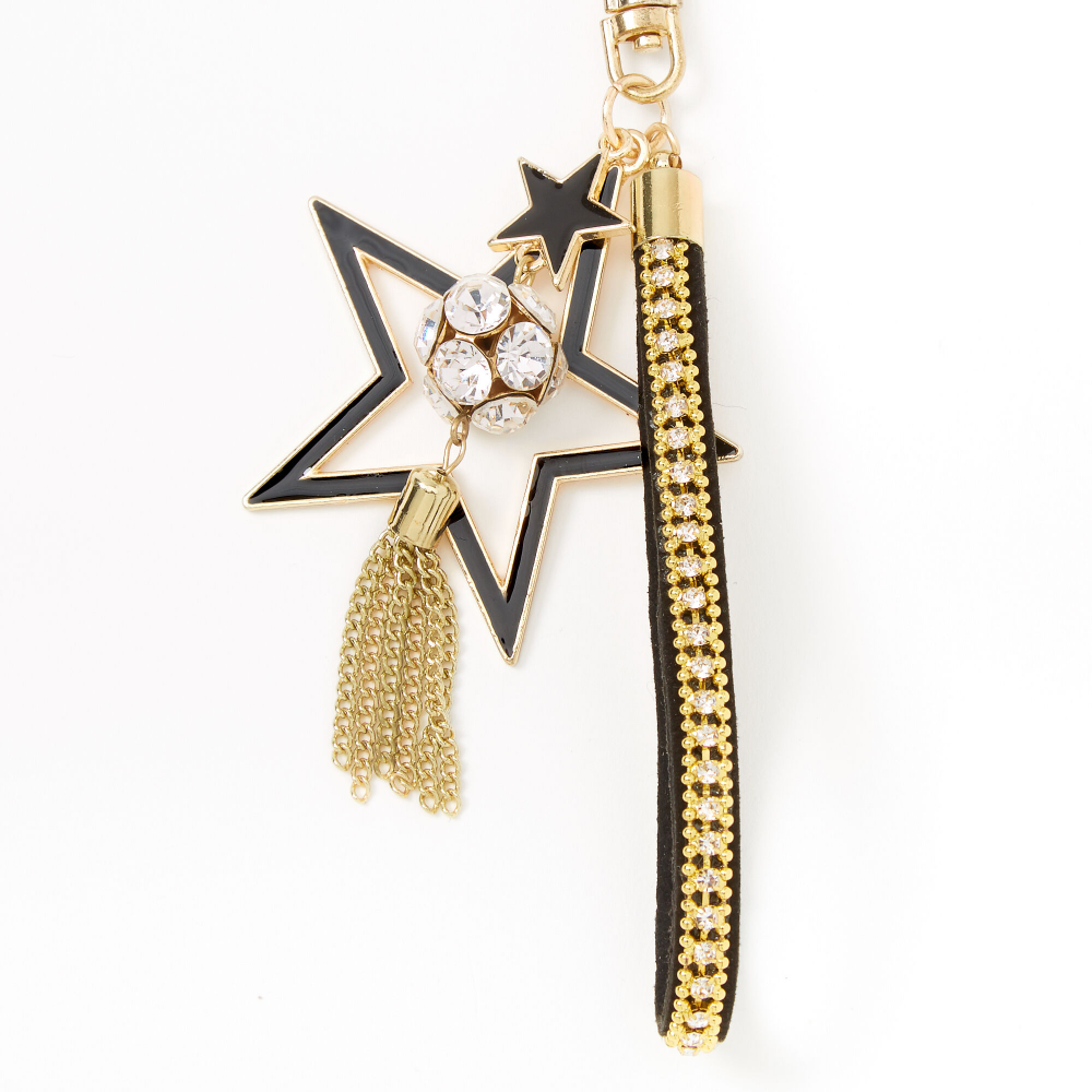 Claire’s Stars & Tassel Keychain – Black